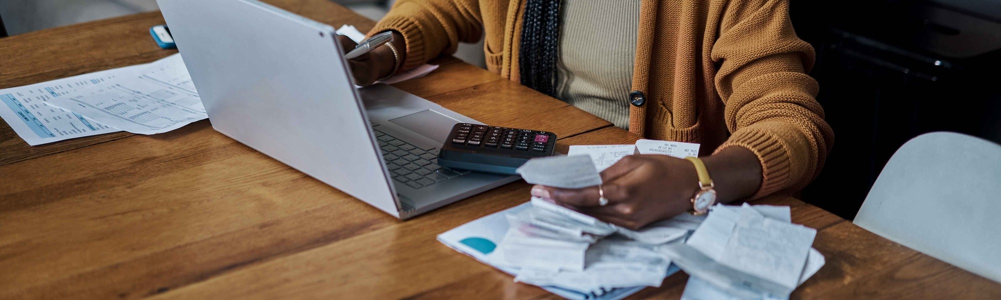 person doing taxes on their laptop