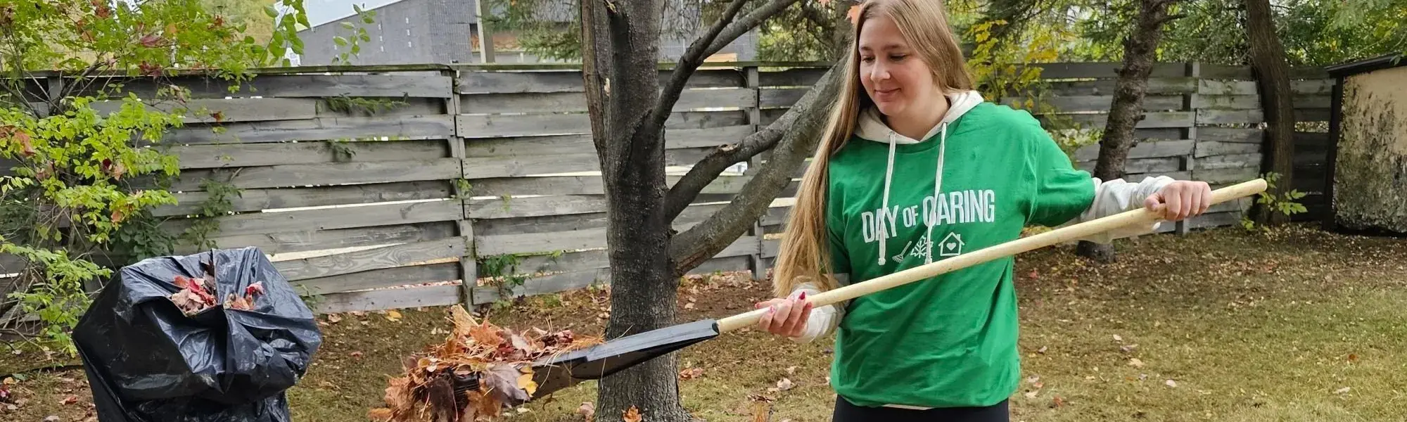 Volunteer raking leaves
